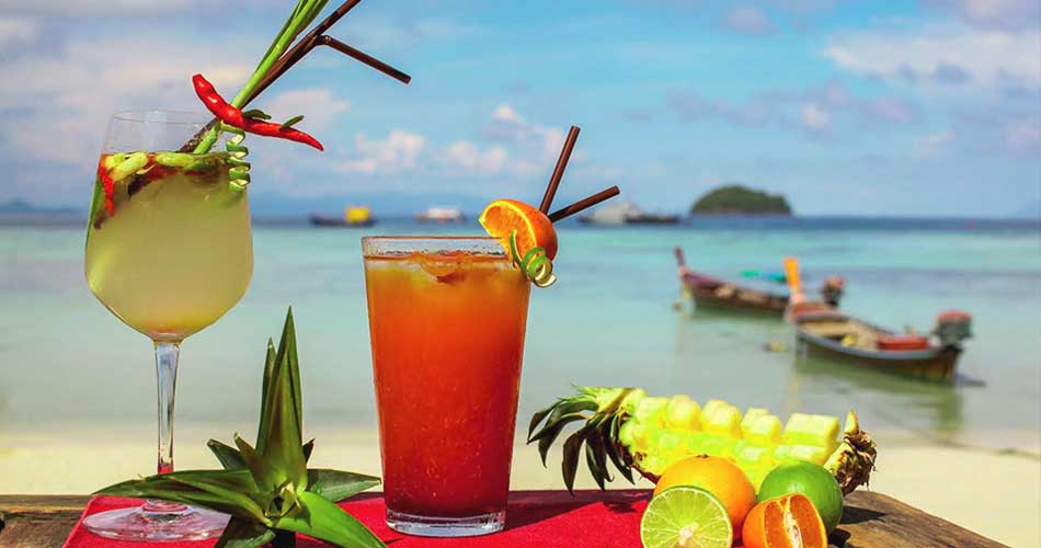 Fresh cocktails and tropical fruit on the beach at Koh Lipe, Thailand